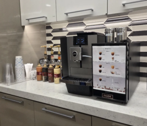 A bean-to-cup machine, syrups and cups installed in a downtown Orlando law office