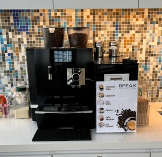 JURA Giga X8 with two bean hoppers installed in a Florida office breakroom