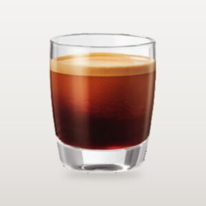 A cup of black filter-style coffee in a straight glass, crema settling across the surface