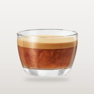 A cold brew latte in a wide glass, cold-brew coffee blended with milk beneath a pale crema band